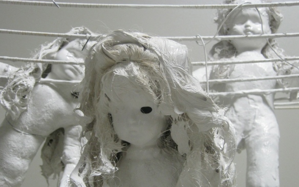 3 dolls painted white